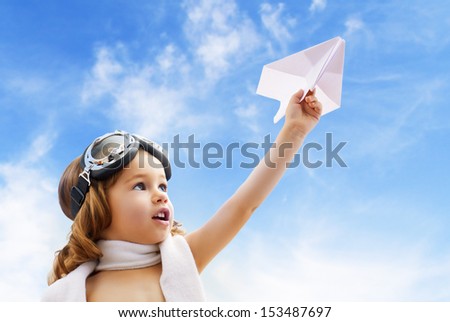 A Child Plays An Airplane Pilot
