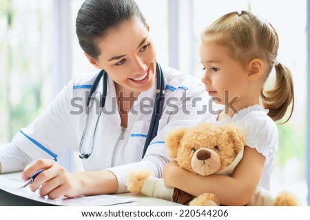 doctor examining a child in a hospital