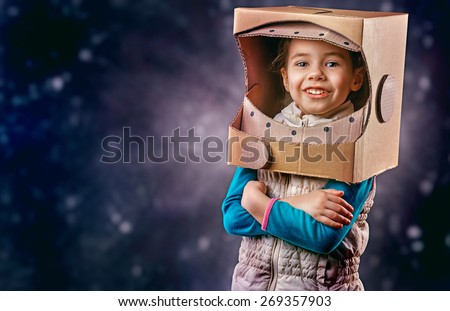child is dressed in an astronaut costume