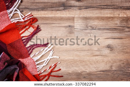 checkered plaid on wooden background
