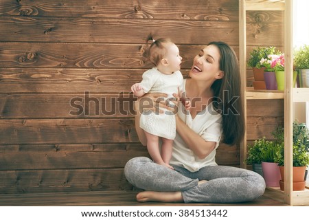 Happy loving family. Mother and her child baby girl playing in the summer day.