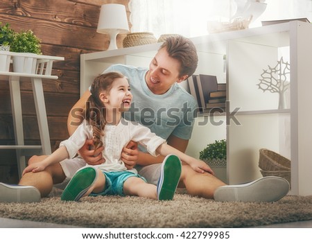Happy loving family. Father and his daughter child girl playing and hugging. Concept of Father\'s day.