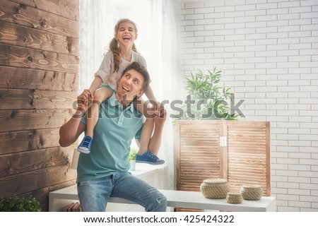 Happy loving family. Father and his daughter child girl playing together. Father\'s day concept.