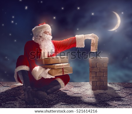 Merry Christmas and happy holidays! Santa Claus sitting on the roof of the house and puts the presents in the chimney. Christmas legend concept.