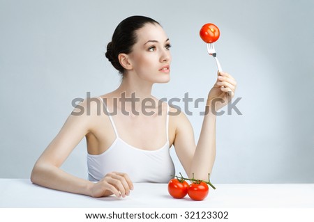 A beautiful slender girl eating healthy food
