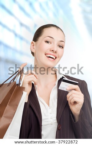 a young woman holding new credit 