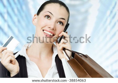 a young woman holding new credit card