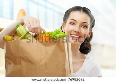 girl holding a bag of food