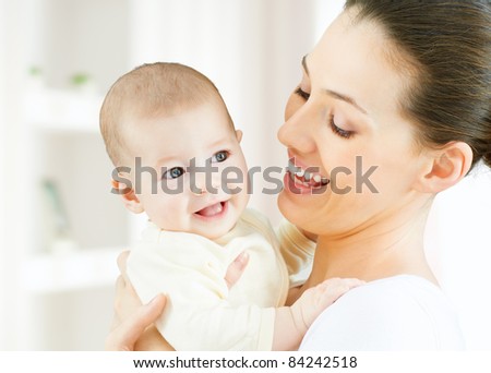 happy mother holding her baby