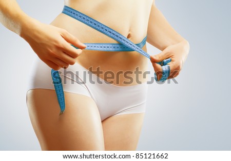 girl taking measurements of her body