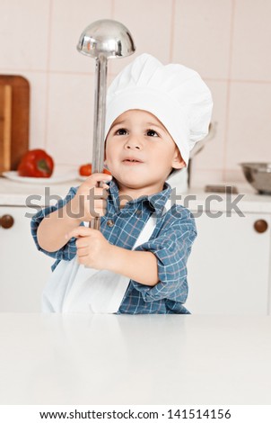 Portrait of a little chef hat and apron