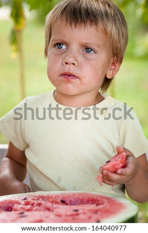 Young blond boy has healthy eating habits