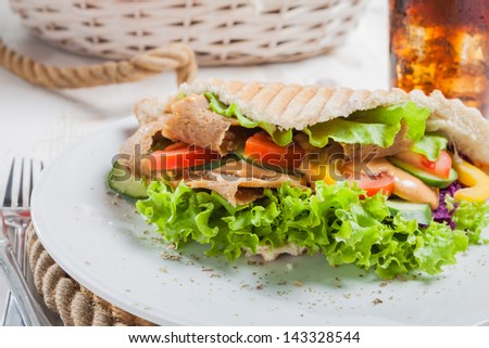Kebab in pita bread close-up