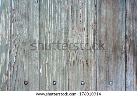 Wooden background - wooden board with a nail head