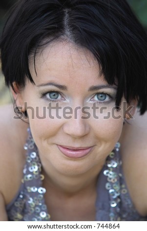 beautiful natural smiling girl in silver top