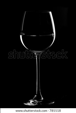 one wine glasses in backlight on the black  contrast background