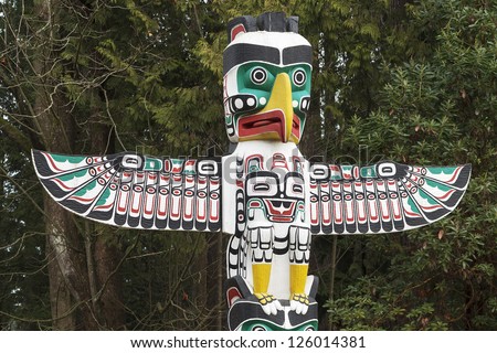 stock-photo-detail-of-a-native-american-thunderbird-totem-pole-126014381.jpg