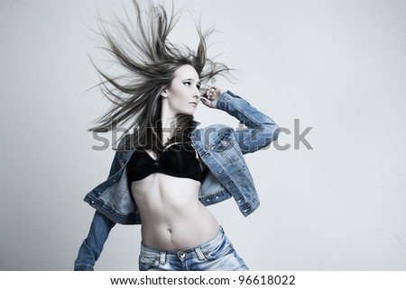 portrait of a beautiful woman in the movement of the developing hair