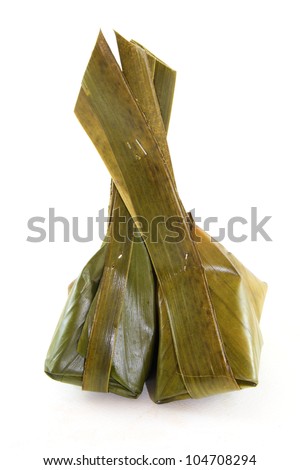 Thai dessert. Coconut milk and Steamed rice dough with sweet coconut stuffing.Packaging from banana leaf.