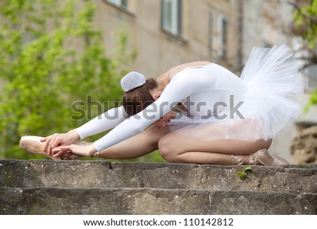 Ballerina training herself, outdoor