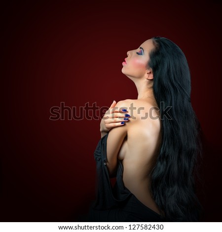 Fine art portrait of half-naked young woman with colorful makeup