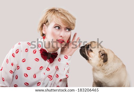 Vintage style woman listening to her dog