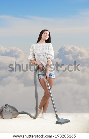 Girl dreams while she tidies up the room, cloudy sky background