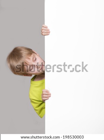 Boy looking around the corner Boy looking around the corner