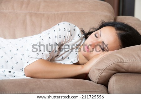 Woman sleeping on the couch
