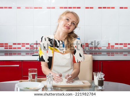 girl with floury hands dreaming in the kitchen