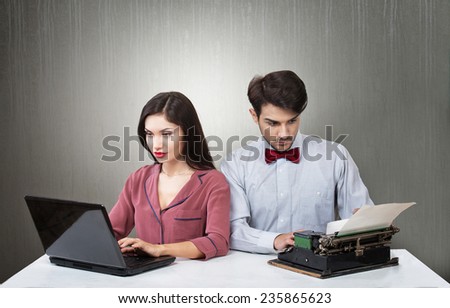 Blogger evolution concept.  Woman using a laptop and retro style man sitting beside her typing on a typewriter