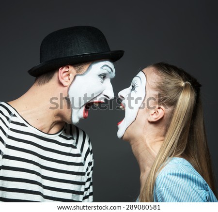 Couple of mimes furiously shouting at each other
