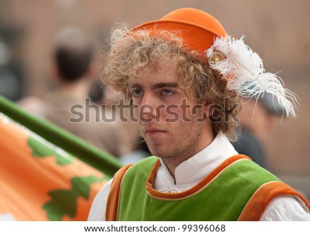 SIENNA, ITALY  APRIL 29: Feast day of St. Catherine of Sienna. Young man in medieval costume participated. Ceremonial procession devoted to the anniversary of St. Catherine on April 29, 2011