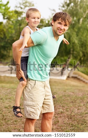 Family Father Man and Son Boy Child playing Outdoor Happiness emotion with summer nature on background