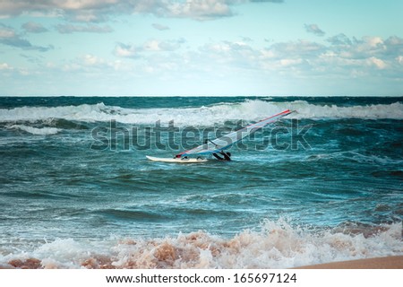 Sea Windsurfing Sport sailing water active leisure Windsurfer training on waves summer day