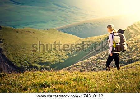 Woman Traveler With Backpack Hiking In Mountains With Beautiful Summer Landscape On Background Mountaineering Sport Lifestyle Concept
