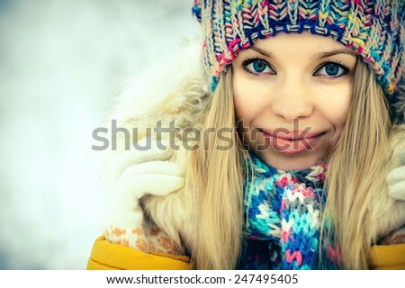 Winter Woman Face portrait happy smiling in knitting hat and scarf Fashion clothing outdoor Travel Lifestyle snow nature on background