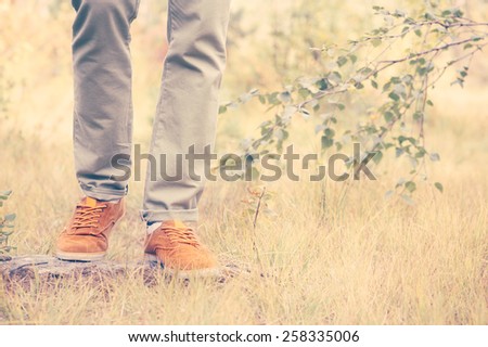 Feet Man walking Outdoor Lifestyle Fashion nature on background retro colors