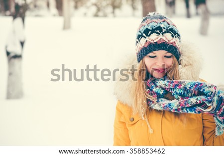 Young Woman happy smiling wearing hat and scarf walking outdoor winter snow Travel Fashion Lifestyle