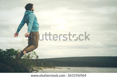 Young Man Flying levitation jumping outdoor relax Lifestyle Travel happiness spiritual concept moody colors