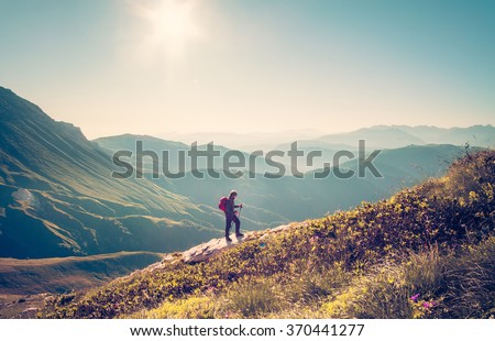 Man Traveler with backpack trekking Travel Lifestyle concept mountains on background Summer vacations activity outdoor aerial view