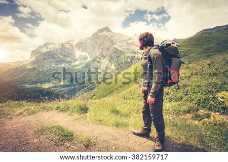 Traveler Man with backpack hiking Travel Lifestyle concept mountains on background Summer journey adventure vacations outdoor