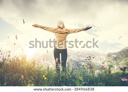 Woman Traveler hands raised hiking Travel Lifestyle concept Summer vacations outdoor  mountains on background view from the ground