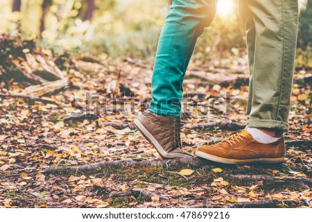 Happy Couple Man and Woman Feet in Love Romantic Outdoor Lifestyle with Autumn nature on background Lifestyle Fashion trendy style