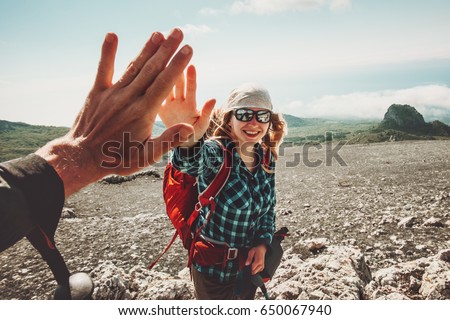 Happy Friends giving five hands traveling at mountains Travel Lifestyle positive emotions concept. Young couple together active adventure vacations