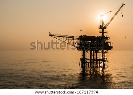 oil platform silhouette when sun set