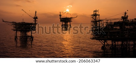 rig platform silhouette in oil and gas industry when sunset