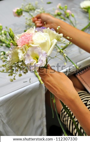 Hand Arranging Flower At school