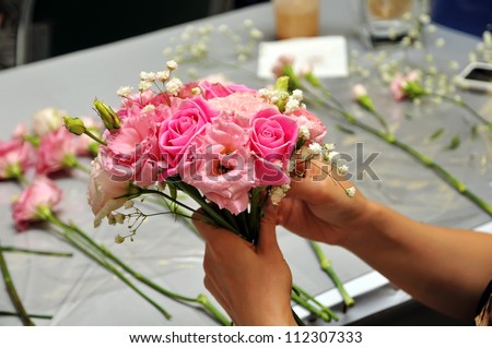 Hand Arranging Flower At school