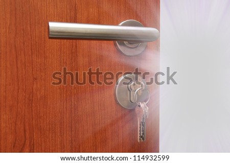 Modren style door handle on natural wooden door with white light